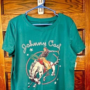 Boutique. Size small. New with tags! Teal colored Johnny cash shirt.
